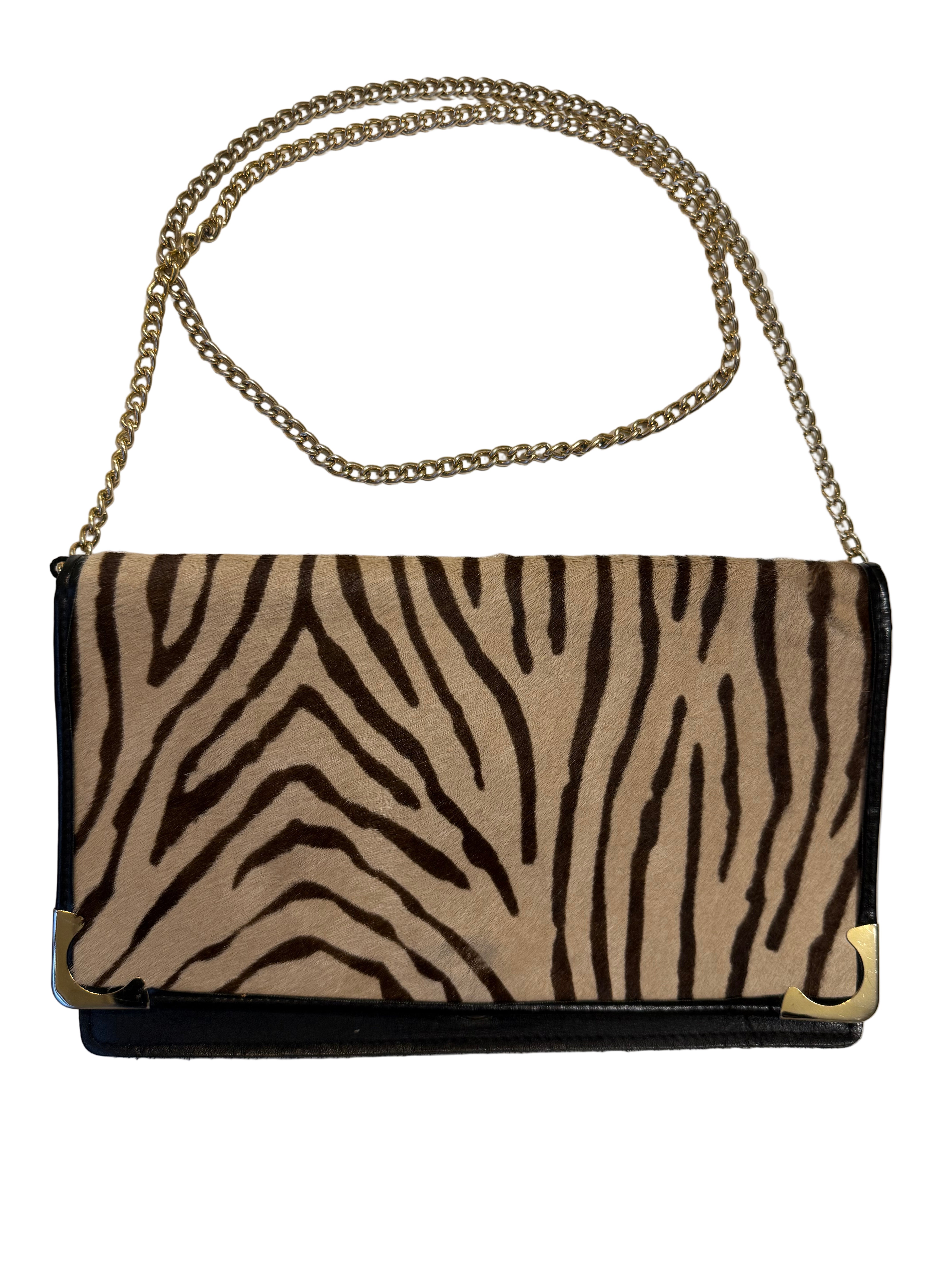 Mała skórzana torebka na łańcuszku