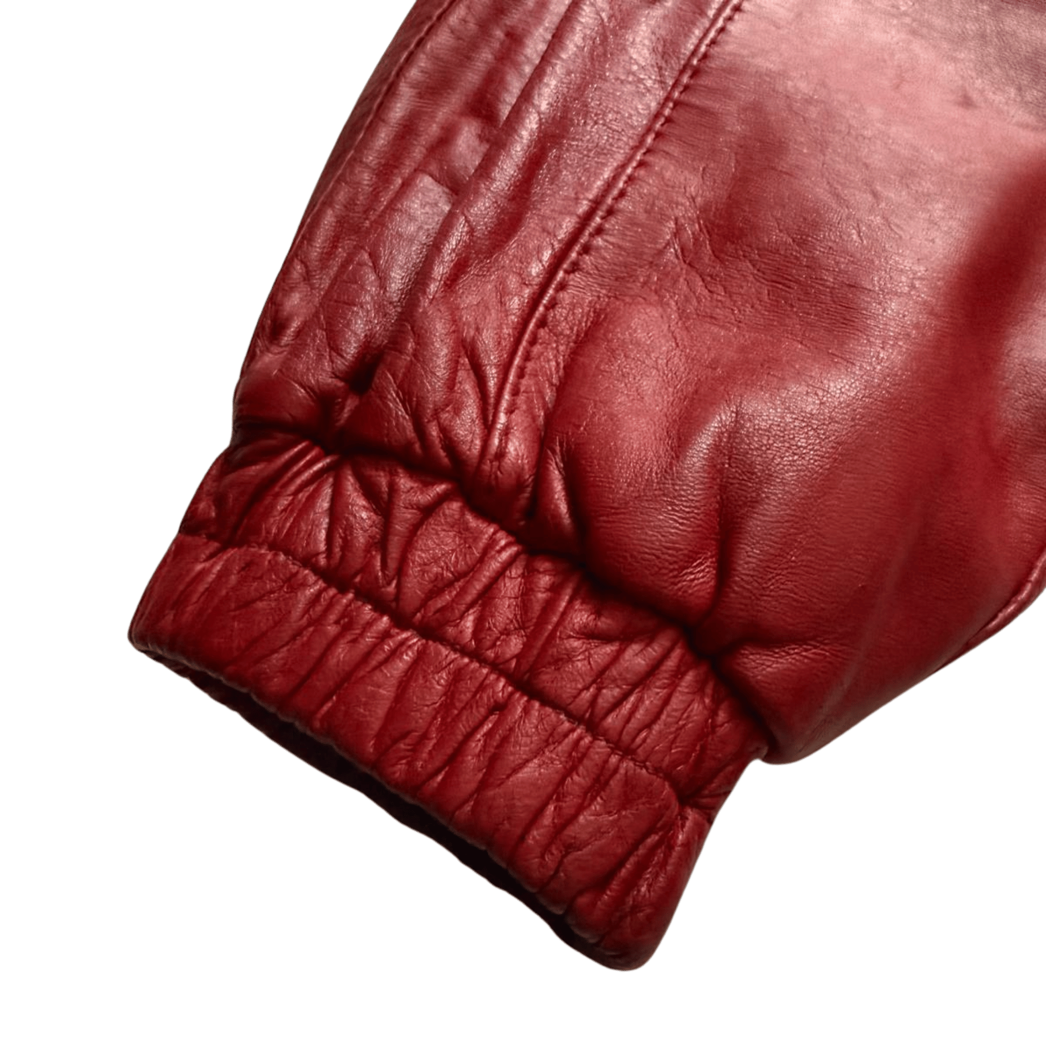 Red leather jacket with a belt and a high stand-up collar in the 80s style.