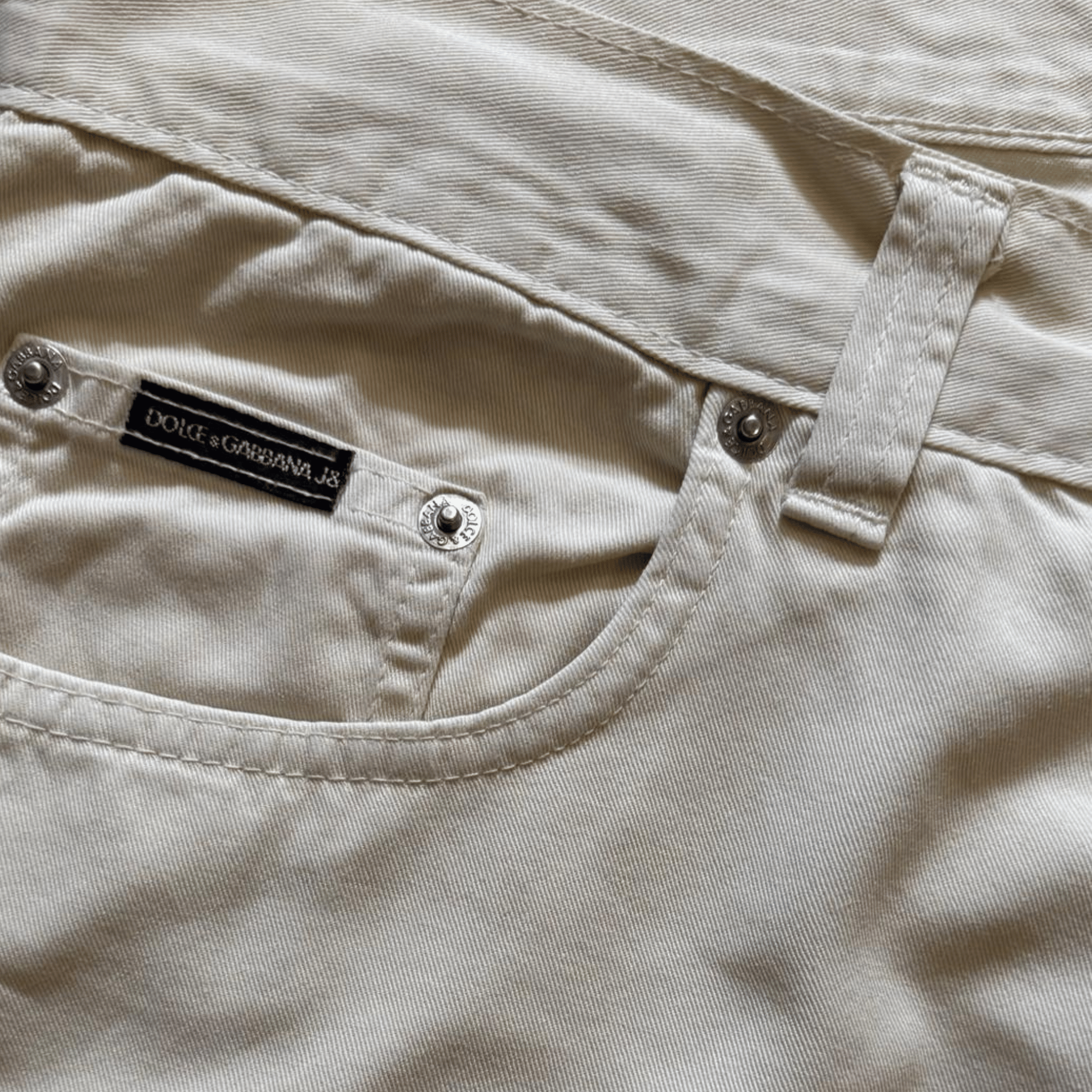 Beżowe spodnie Dolce & Gabbana Jeans – klasyczny fason, bawełna premium