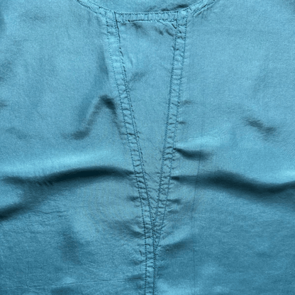 Sleeveless blue silk satin top with a scoop neckline