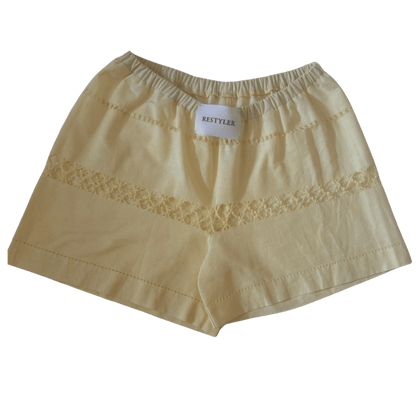 Upcycled women's shorts made from a pastel yellow cotton tablecloth - RESTYLER