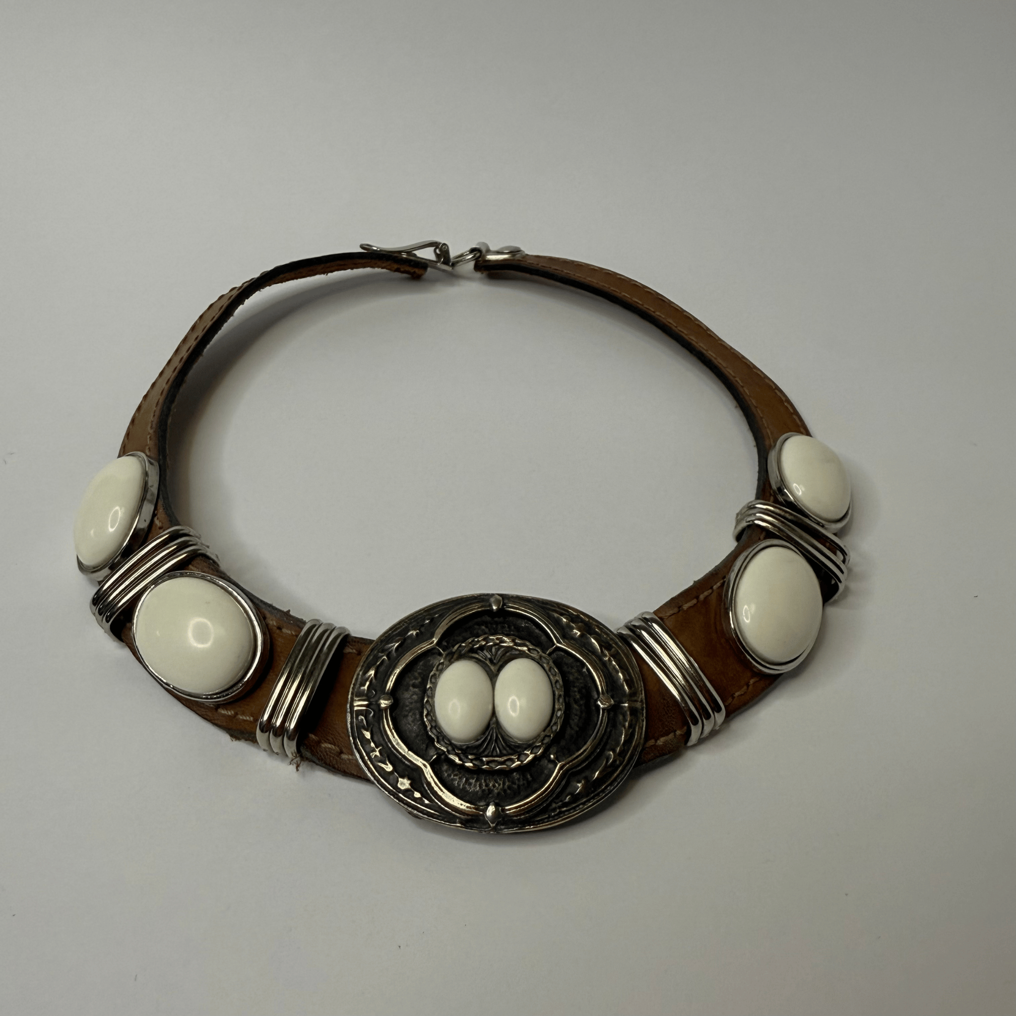 Vintage choker on a leather strap with metal decoration and white cabochons – western meets street