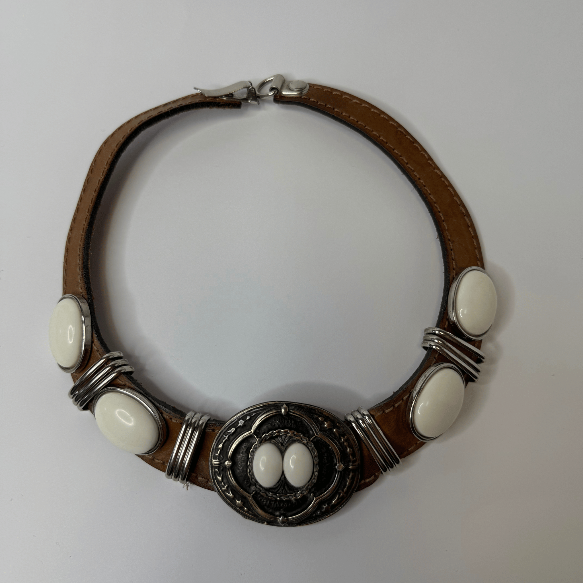 Vintage choker on a leather strap with metal decoration and white cabochons – western meets street