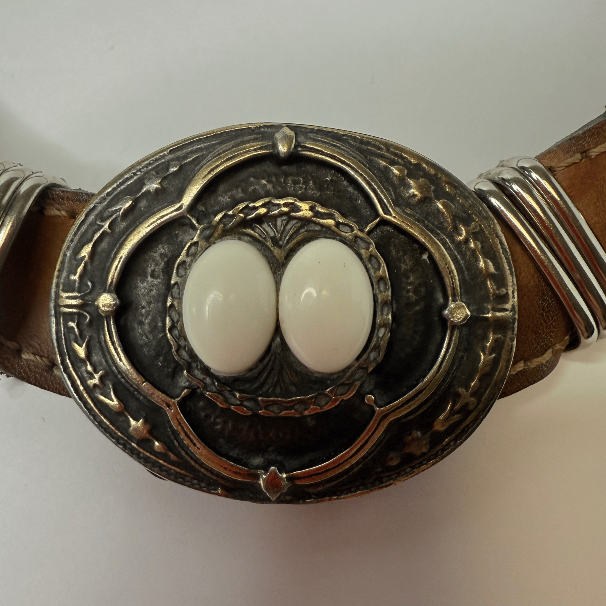 Vintage choker on a leather strap with metal decoration and white cabochons – western meets street